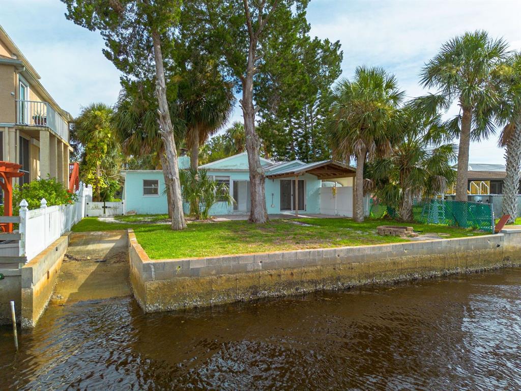 14519 Birch Street Hudson, FL 34667 - Photo 9 of 32 a view of a house with a yard and large trees