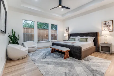 a living room with furniture a fireplace and kitchen view