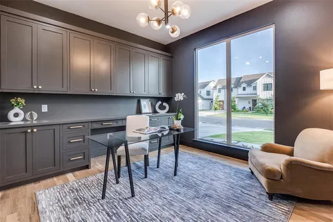 a work room with furniture and wooden floor