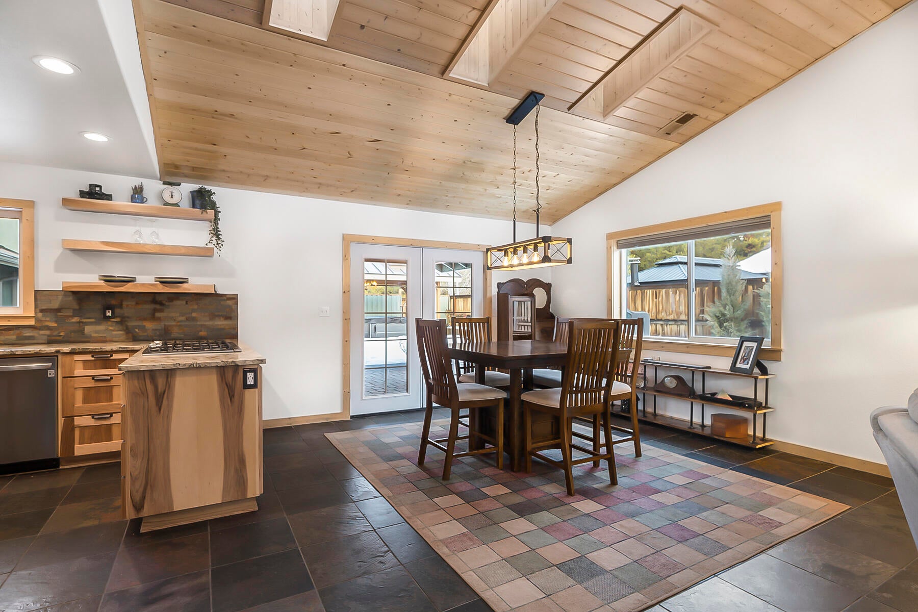 17246 Tholstrup Road Bend, OR 97707 - Photo 12 of 55 Dining area with French doors leading to outdoor kitchen