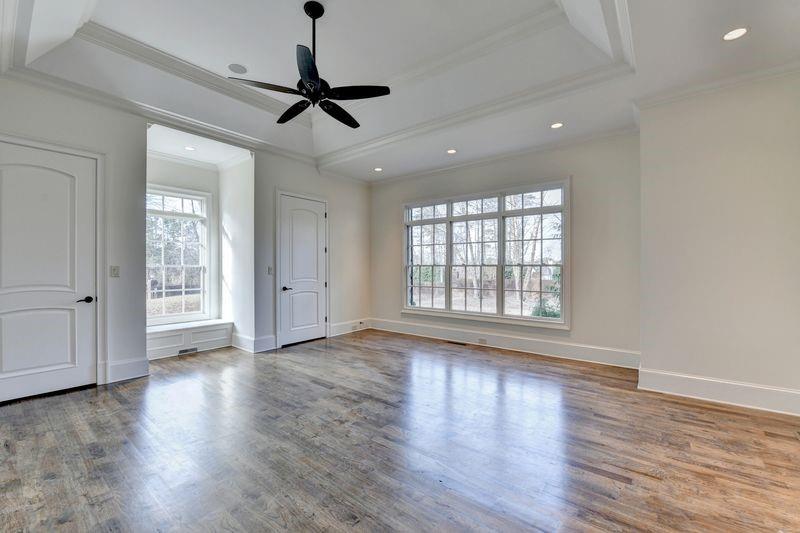 4045 Ridge Road Buford, GA 30519 - Photo 30 of 97 a view of empty room with wooden floor and fan