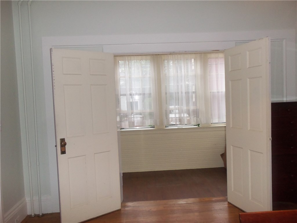 12 Poplar Street Newport, RI 02840 - Photo 19 of 40 Unit 1 Enclosed Front Porch from Bedroom