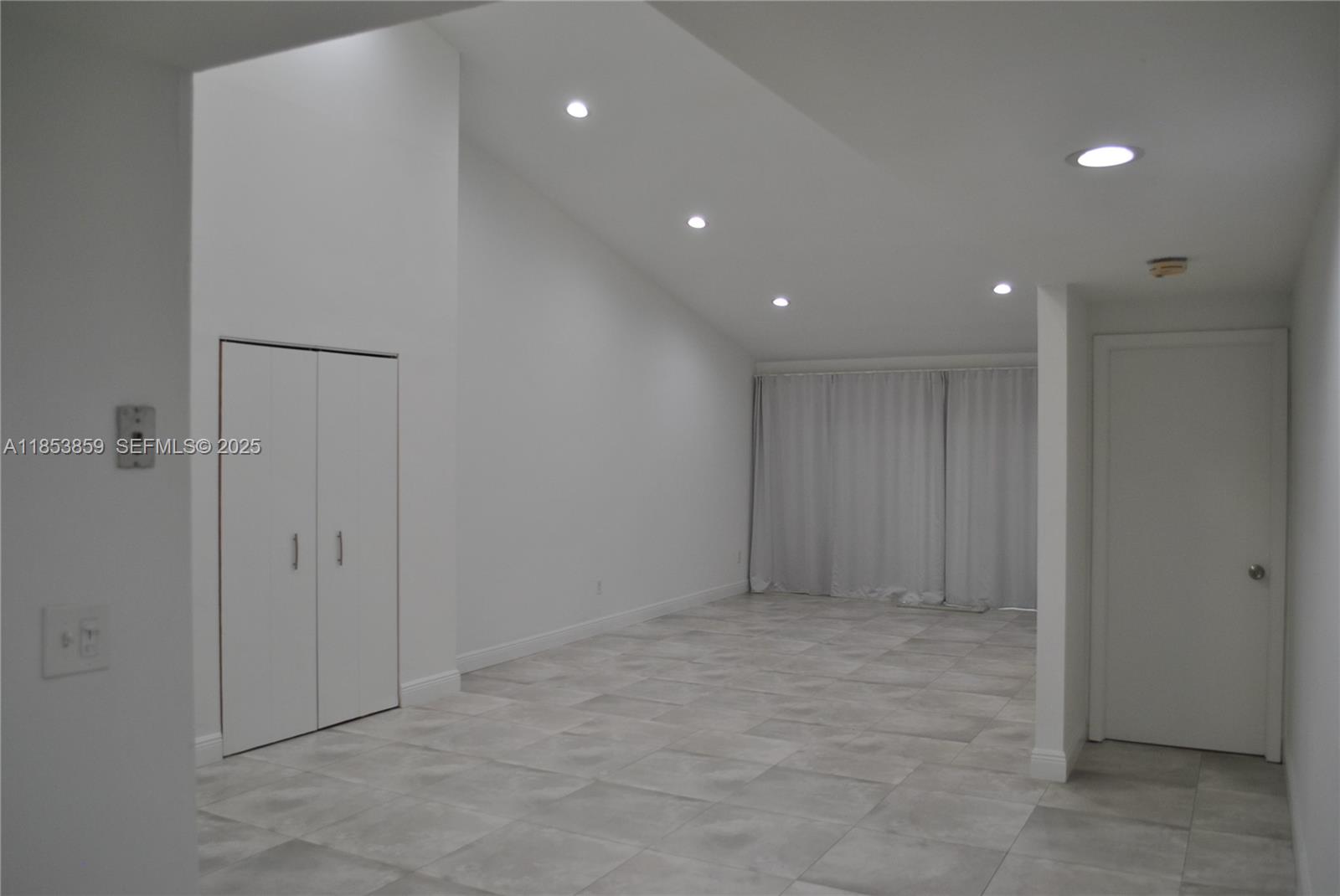 19941 Northeast 5th Court, Unit 3M Miami, FL 33179 - Photo 12 of 25 a view of an empty room