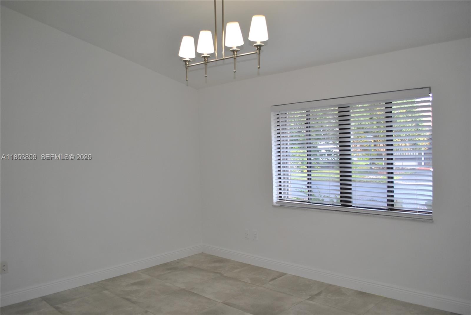 19941 Northeast 5th Court, Unit 3M Miami, FL 33179 - Photo 14 of 25 an empty room with a window