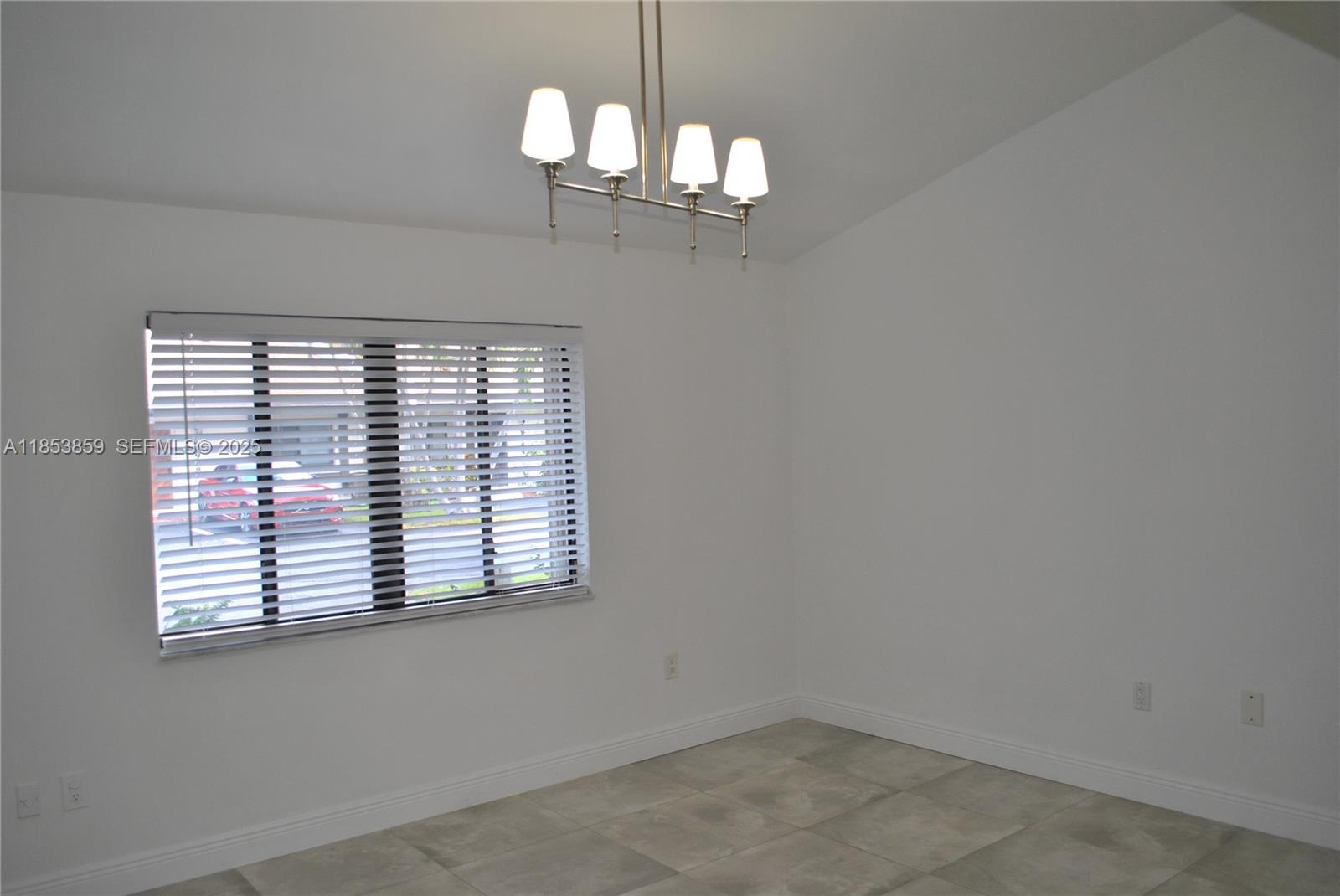 19941 Northeast 5th Court, Unit 3M Miami, FL 33179 - Photo 15 of 25 wooden floor in an empty room with a window