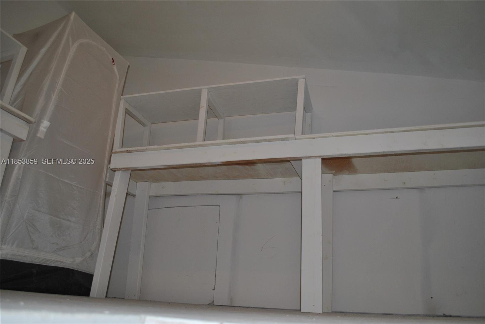19941 Northeast 5th Court, Unit 3M Miami, FL 33179 - Photo 19 of 25 a view of staircase with white walls