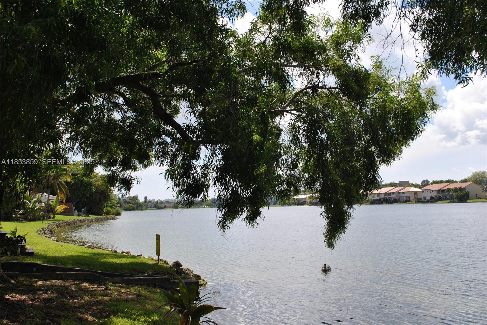 19941 Northeast 5th Court, Unit 3M Miami, FL 33179 - Photo 23 of 25 a view of lake with houses