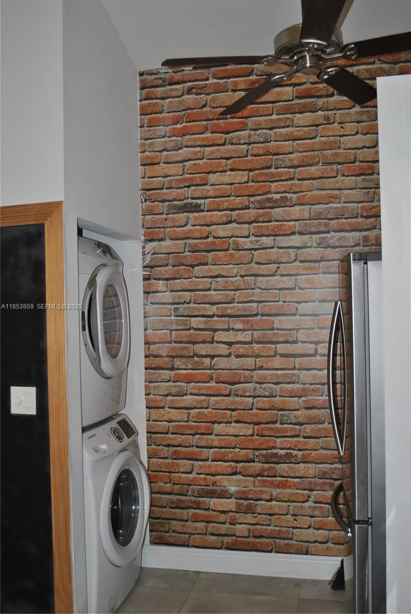 19941 Northeast 5th Court, Unit 3M Miami, FL 33179 - Photo 9 of 25 a view of washer and dryer