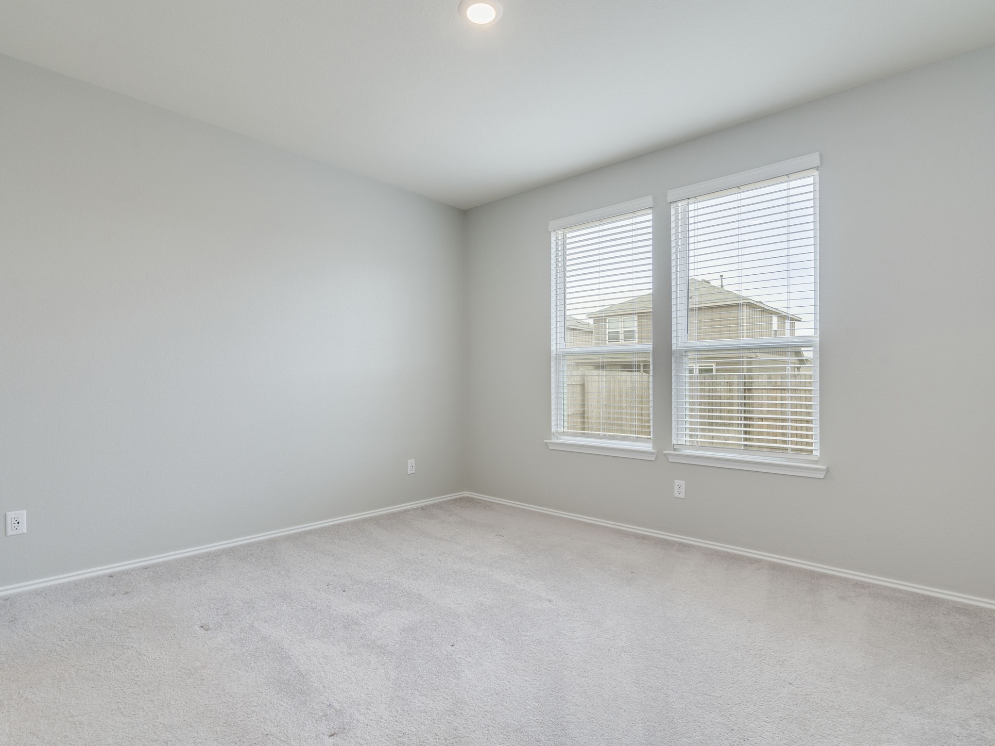 388 Begonia Street Buda, TX 78610 - Photo 11 of 21 Carpeted spare room with baseboards