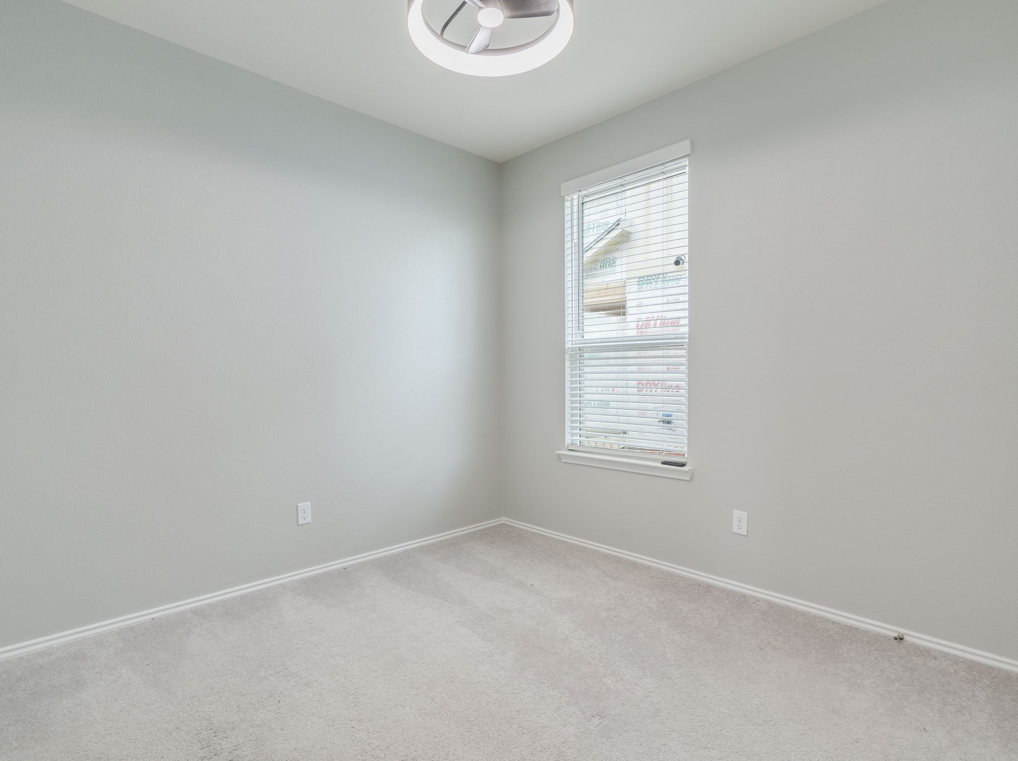 388 Begonia Street Buda, TX 78610 - Photo 14 of 21 Empty room featuring carpet and baseboards