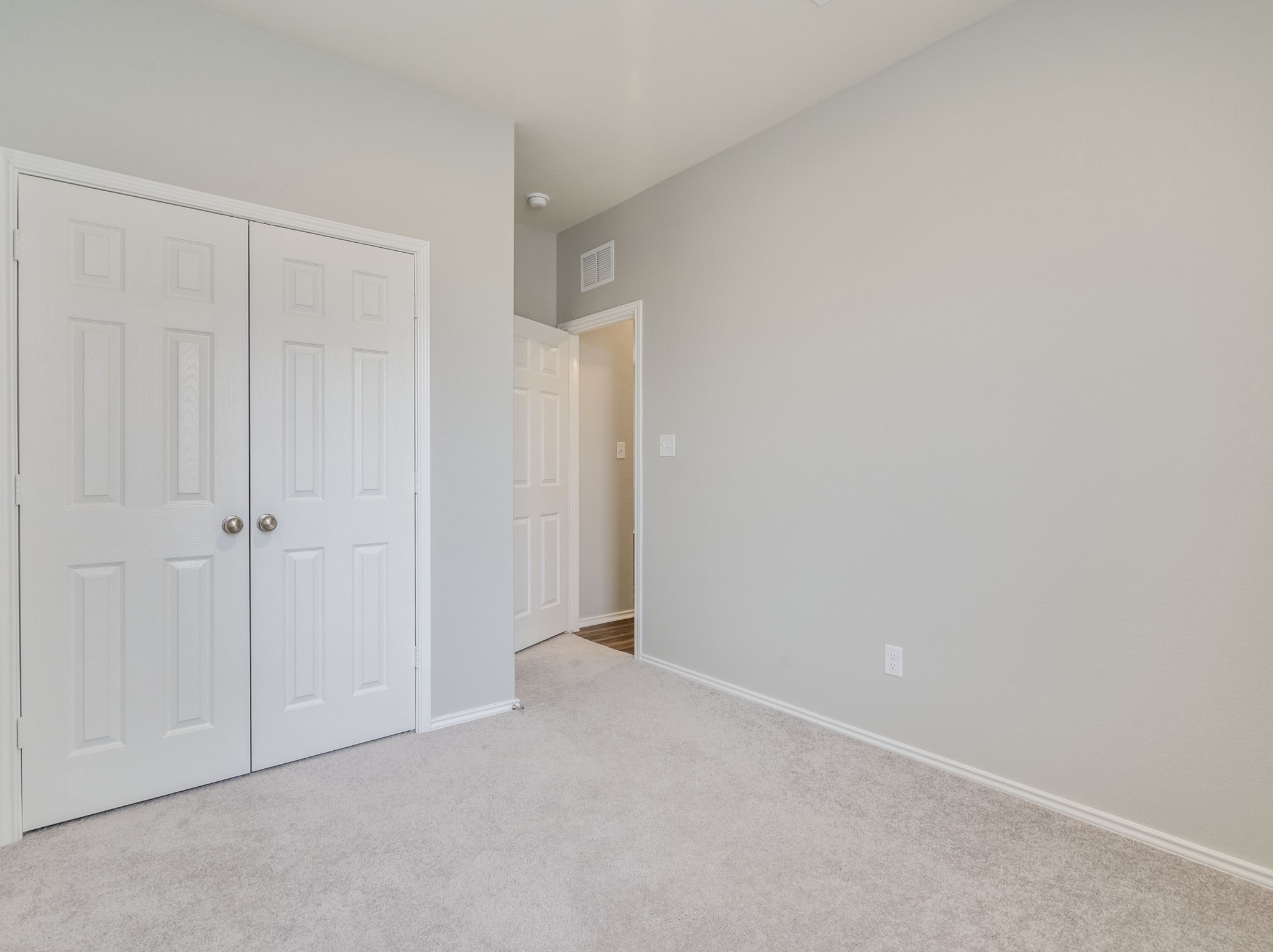 388 Begonia Street Buda, TX 78610 - Photo 17 of 21 Unfurnished bedroom featuring carpet and a closet