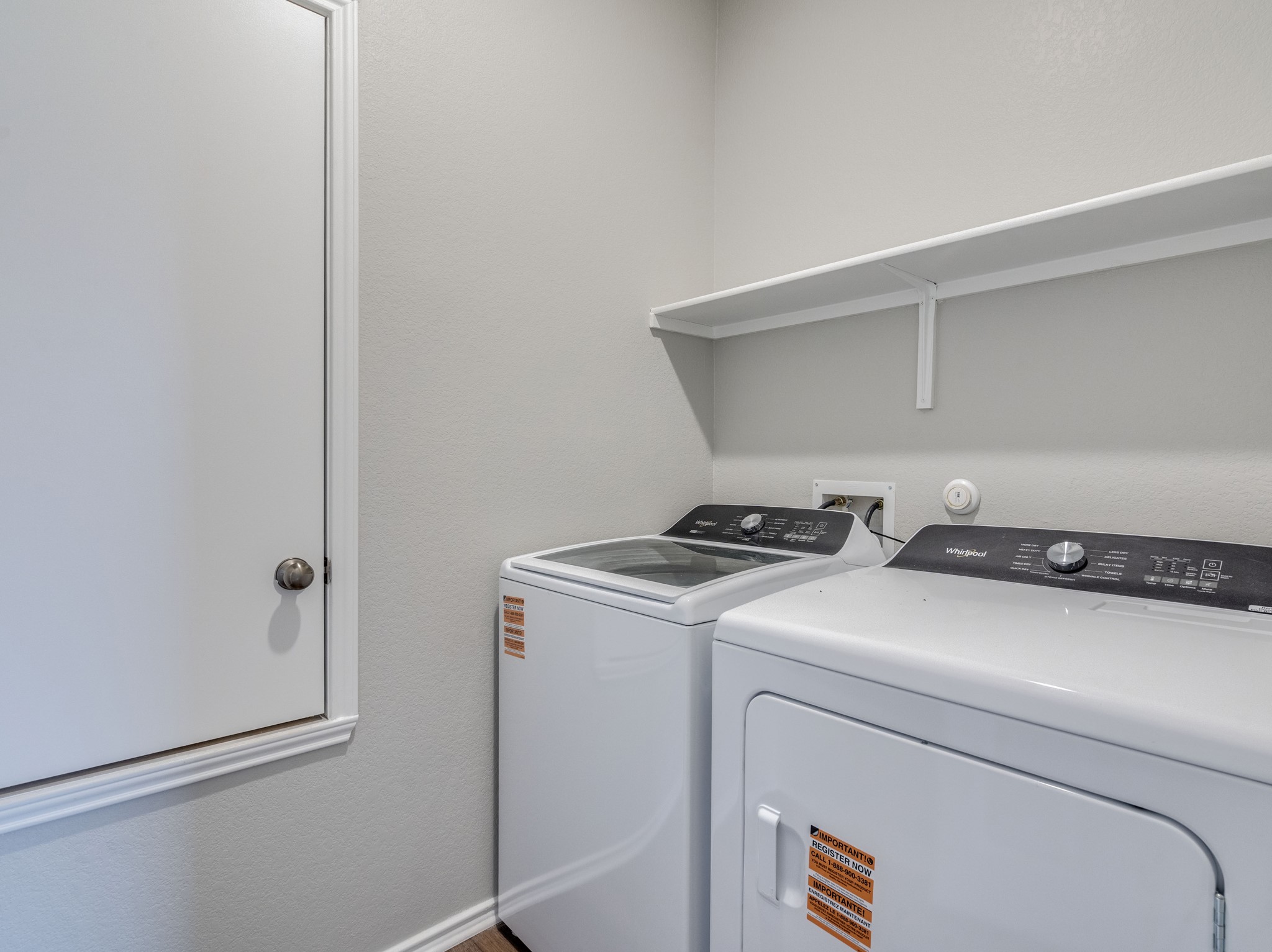 388 Begonia Street Buda, TX 78610 - Photo 20 of 21 Laundry room featuring washer and dryer and a textured wall