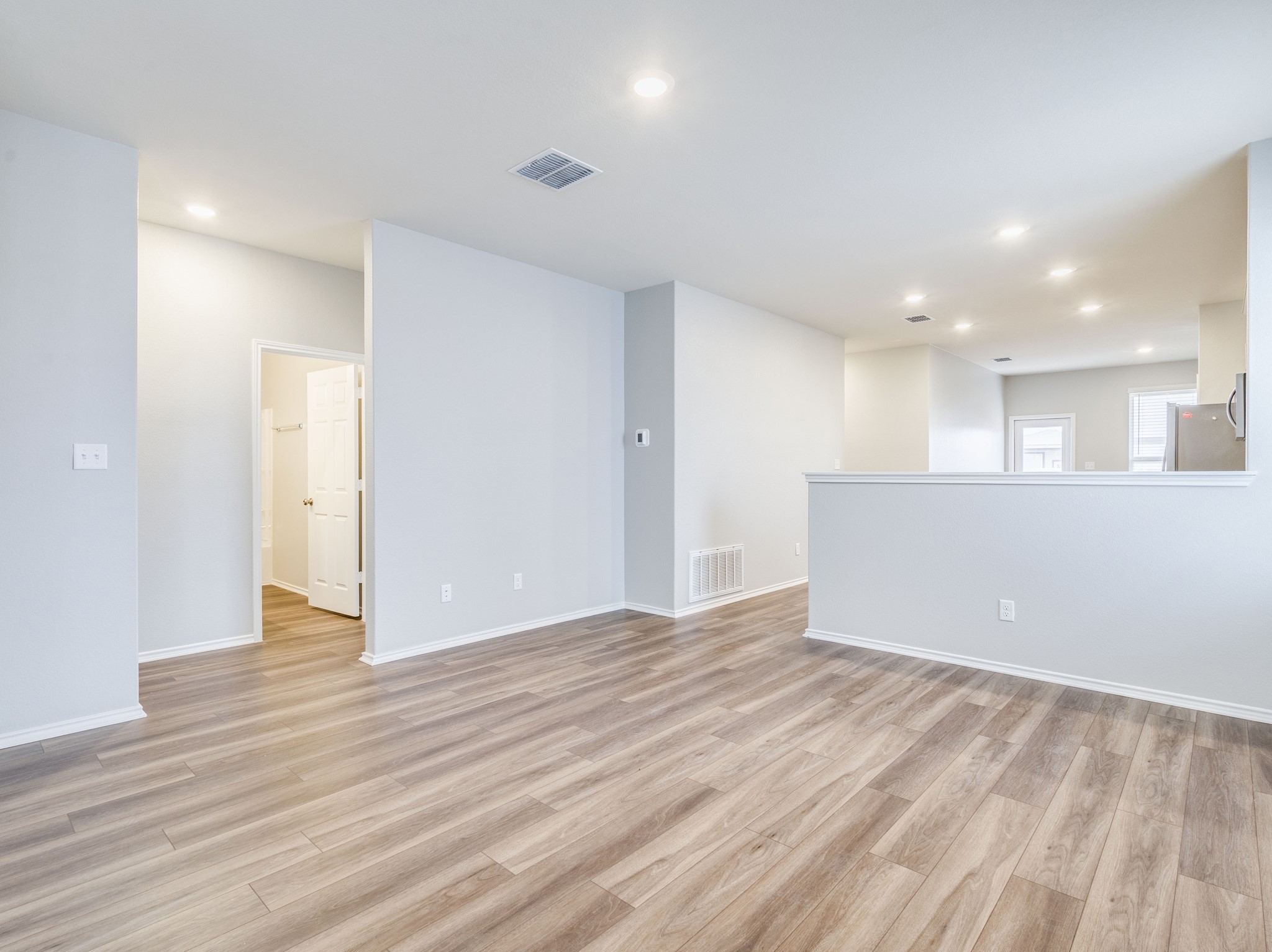 388 Begonia Street Buda, TX 78610 - Photo 4 of 21 Spare room with recessed lighting and light wood-type flooring