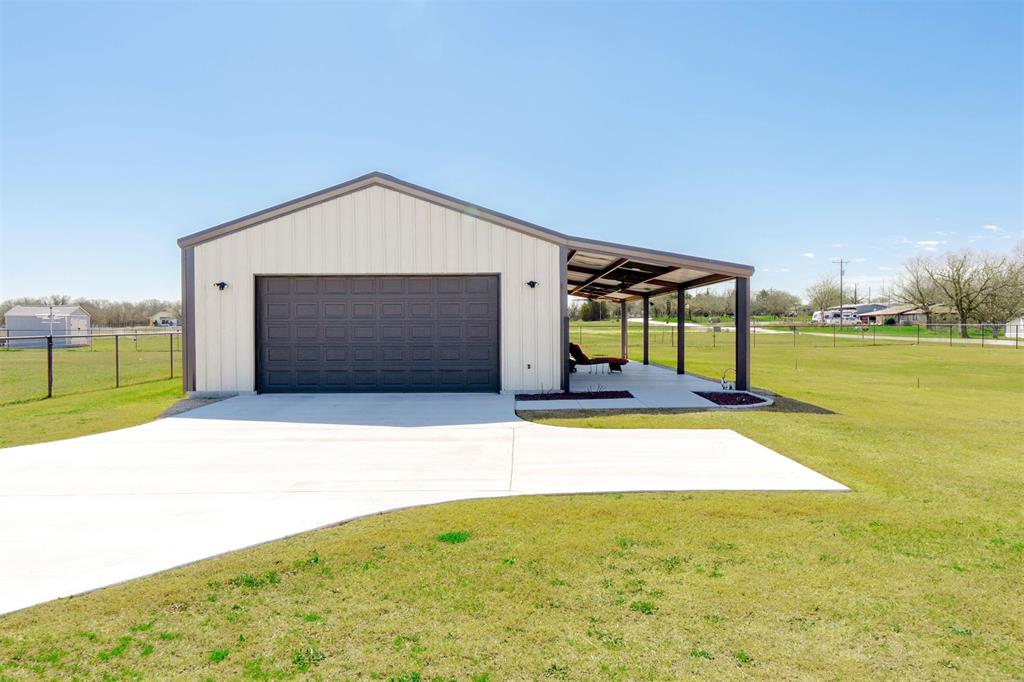 849 County Road 4764 Boyd, TX 76023 - Photo 28 of 40 a front view of a house with a yard