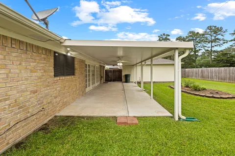 a view of a backyard with plants and a patio