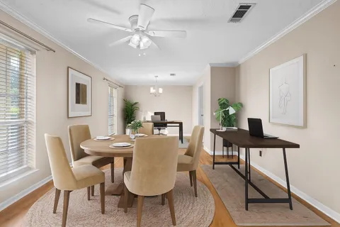 a view of a dining room with furniture
