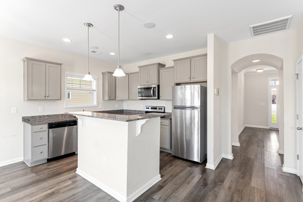 249 Samuel Street Pendleton, SC 29670 - Photo 3 of 33 This kitchen features sleek stainless steel appliances and abundant natural light.