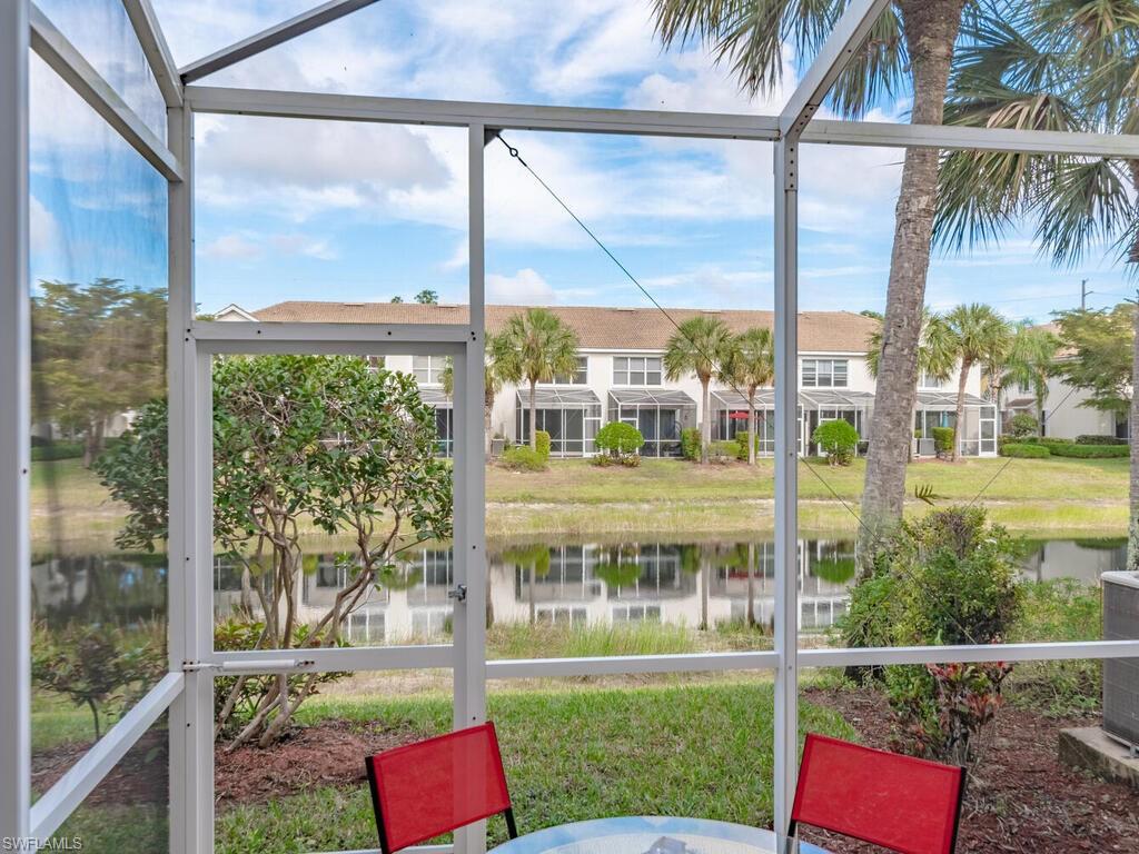 953 Hampton Circle, Unit 112 Naples, FL 34105 - Photo 13 of 35 a front view of a house with a yard