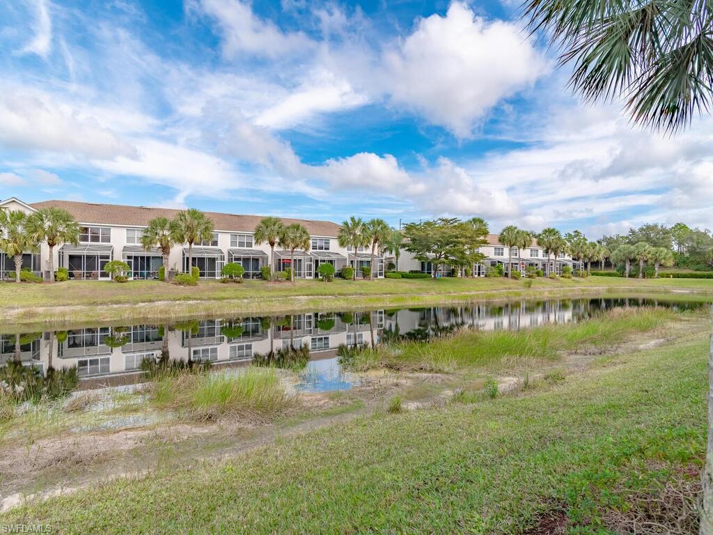 953 Hampton Circle, Unit 112 Naples, FL 34105 - Photo 14 of 35 a view of a lake with houses