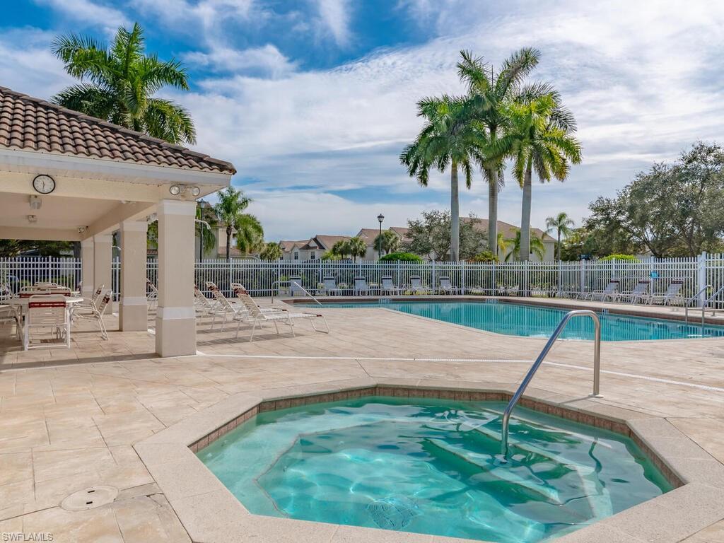 953 Hampton Circle, Unit 112 Naples, FL 34105 - Photo 27 of 35 a view of a backyard