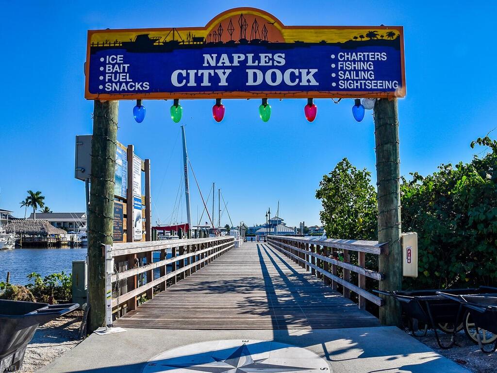 953 Hampton Circle, Unit 112 Naples, FL 34105 - Photo 33 of 35 a view of street with an entrance and flowers