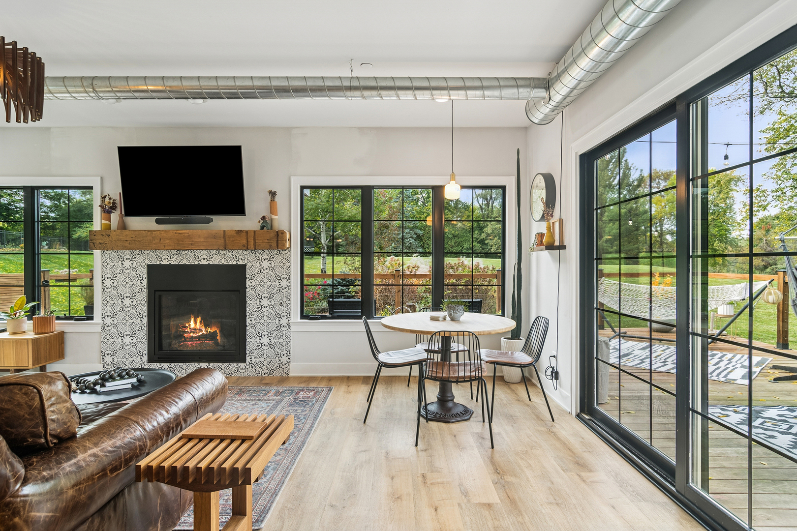 21318 Illinois Rte 59 Barrington, IL 60010 - Photo 11 of 42 a living room with furniture fireplace and flat screen tv