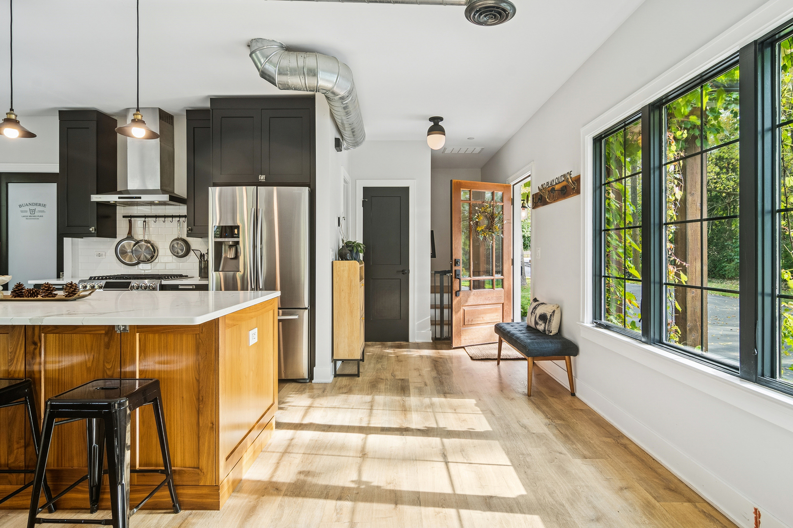 21318 Illinois Rte 59 Barrington, IL 60010 - Photo 16 of 42 a large kitchen with granite countertop a stove a refrigerator and a sink