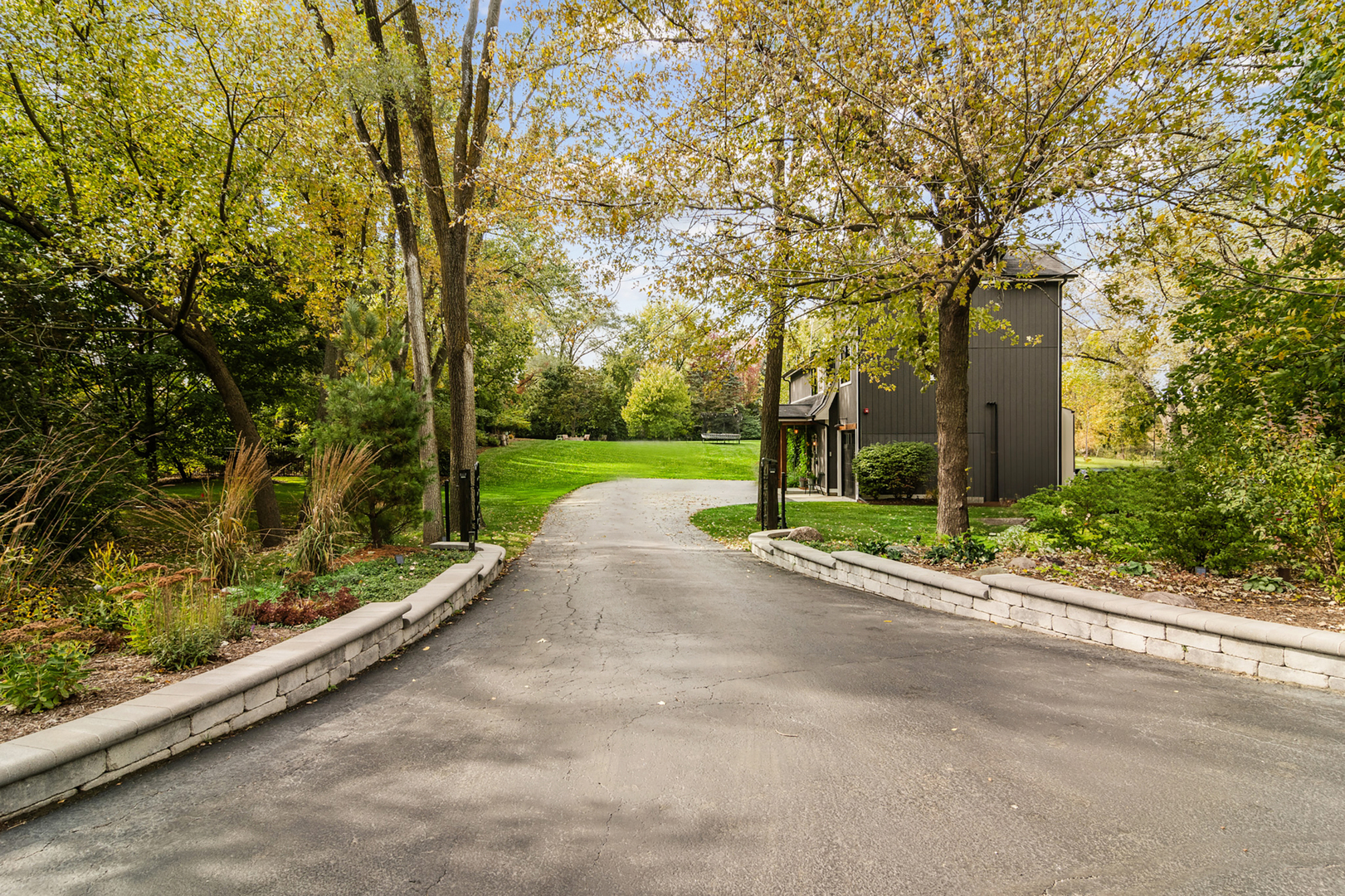 21318 Illinois Rte 59 Barrington, IL 60010 - Photo 39 of 42 a view of a street with a large trees and a small barn