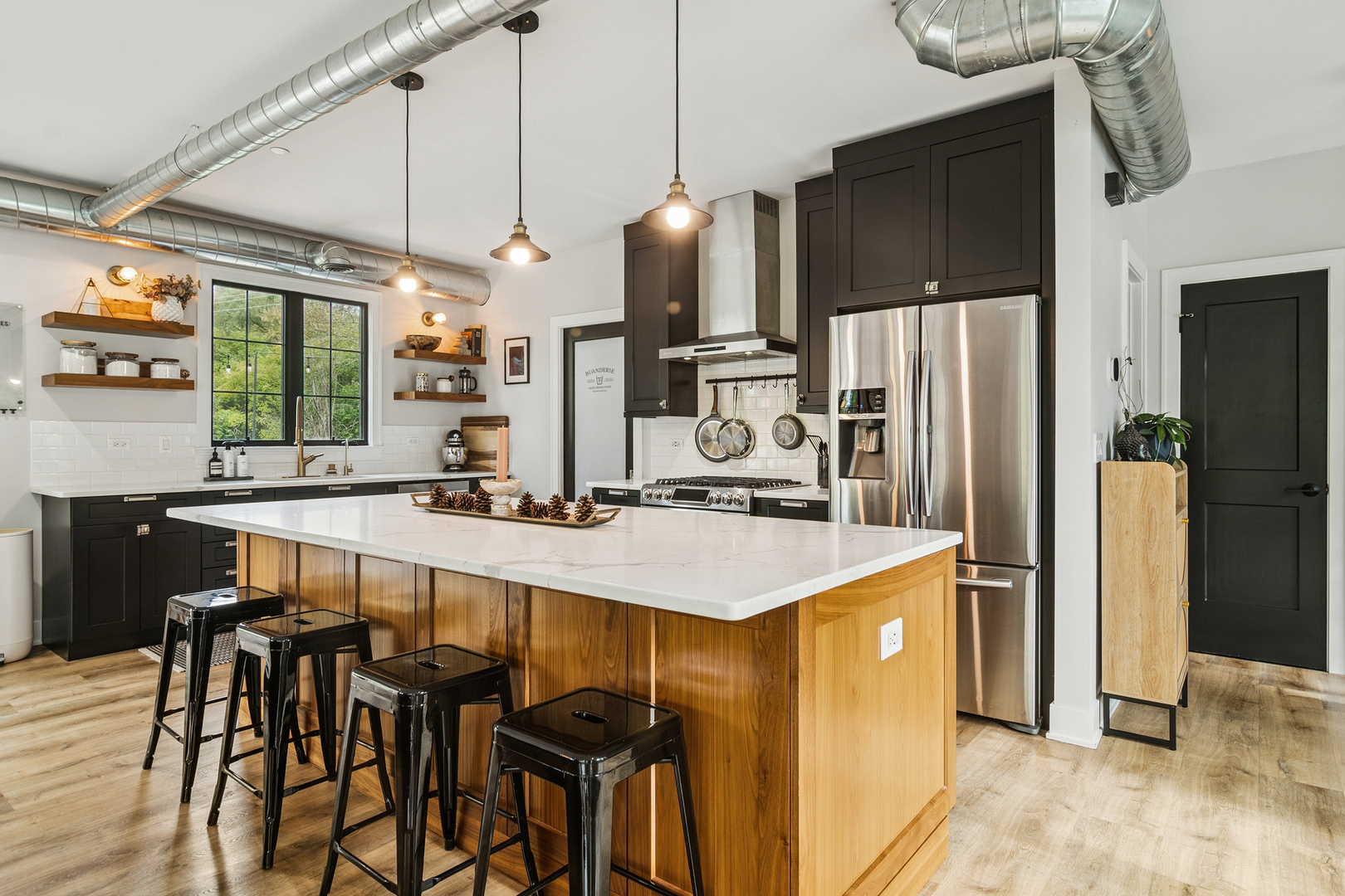 21318 Illinois Rte 59 Barrington, IL 60010 - Photo 5 of 42 a kitchen with stainless steel appliances a table chairs and refrigerator
