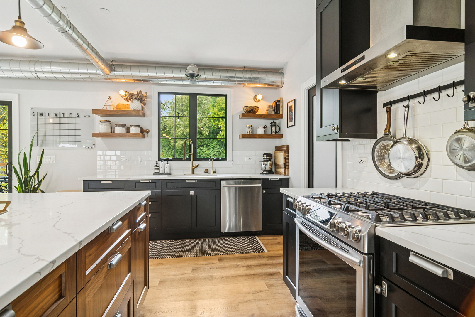 21318 Illinois Rte 59 Barrington, IL 60010 - Photo 8 of 42 a kitchen with a stove and a sink