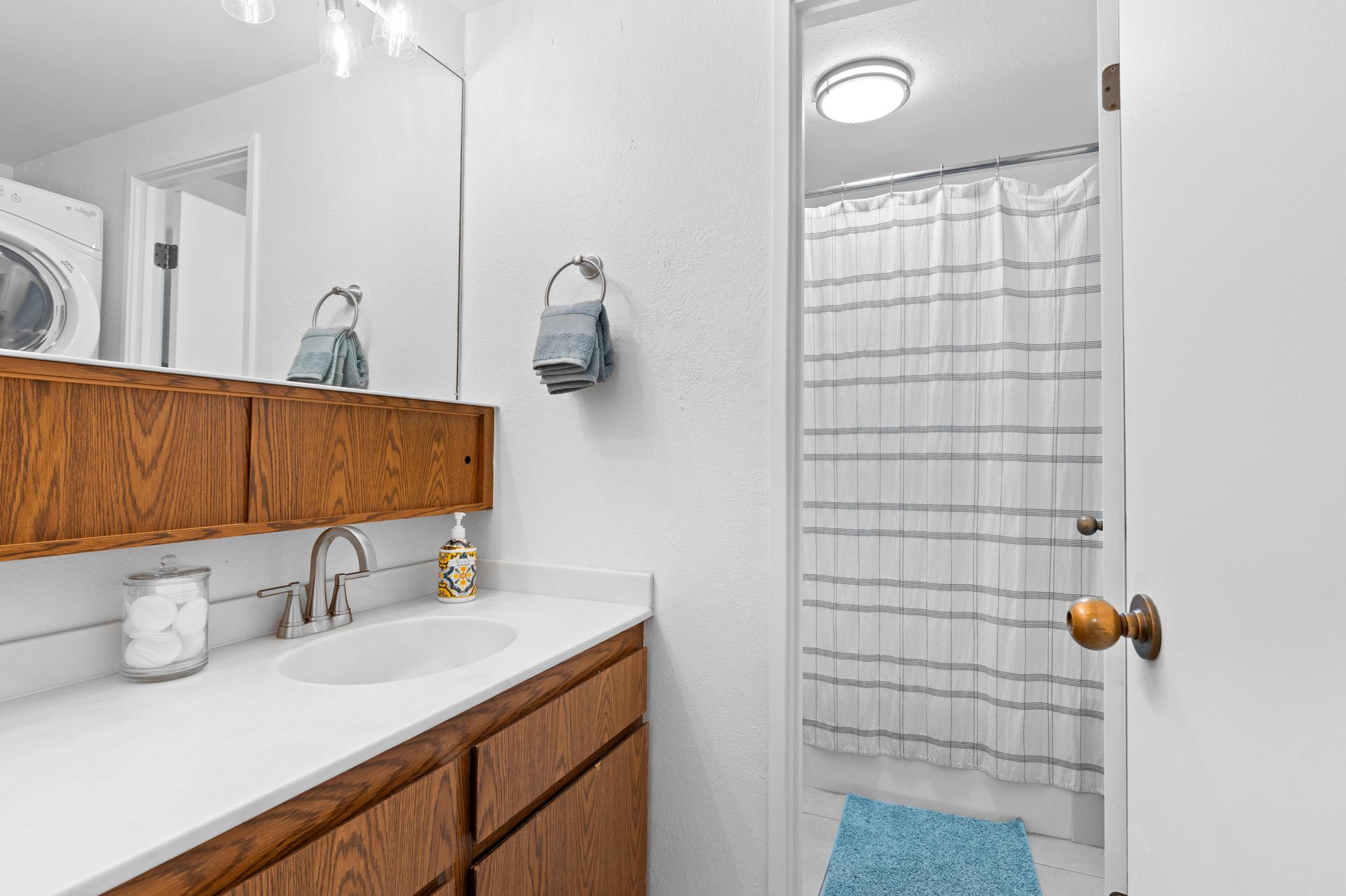 68-3840 Lua Kula Street, Unit F203 Waikoloa, HI 96738 - Photo 12 of 29 a bathroom with a sink and a mirror