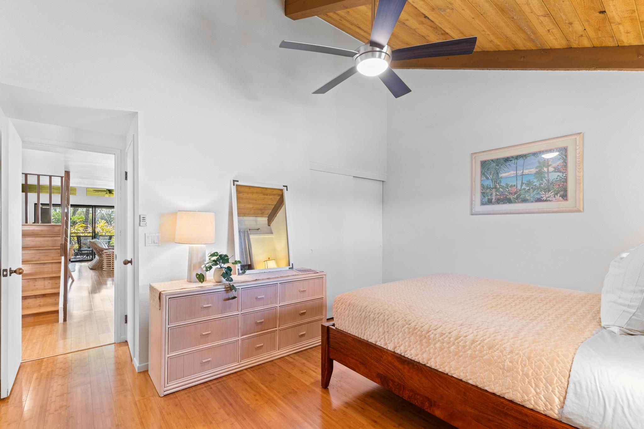 68-3840 Lua Kula Street, Unit F203 Waikoloa, HI 96738 - Photo 15 of 29 a bedroom with a bed and a table