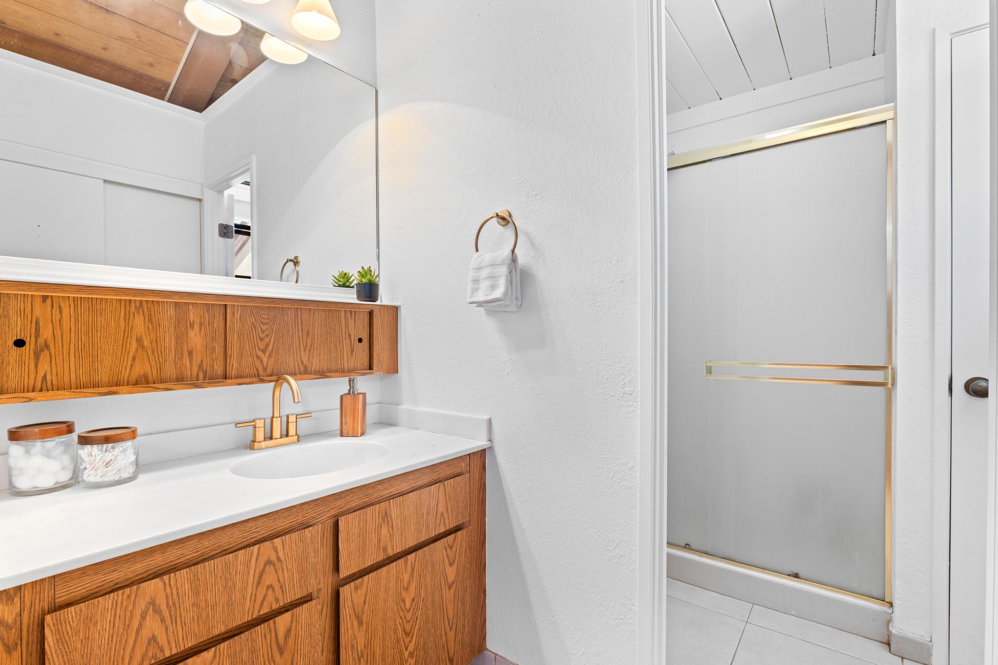 68-3840 Lua Kula Street, Unit F203 Waikoloa, HI 96738 - Photo 18 of 29 a bathroom with a sink and a mirror
