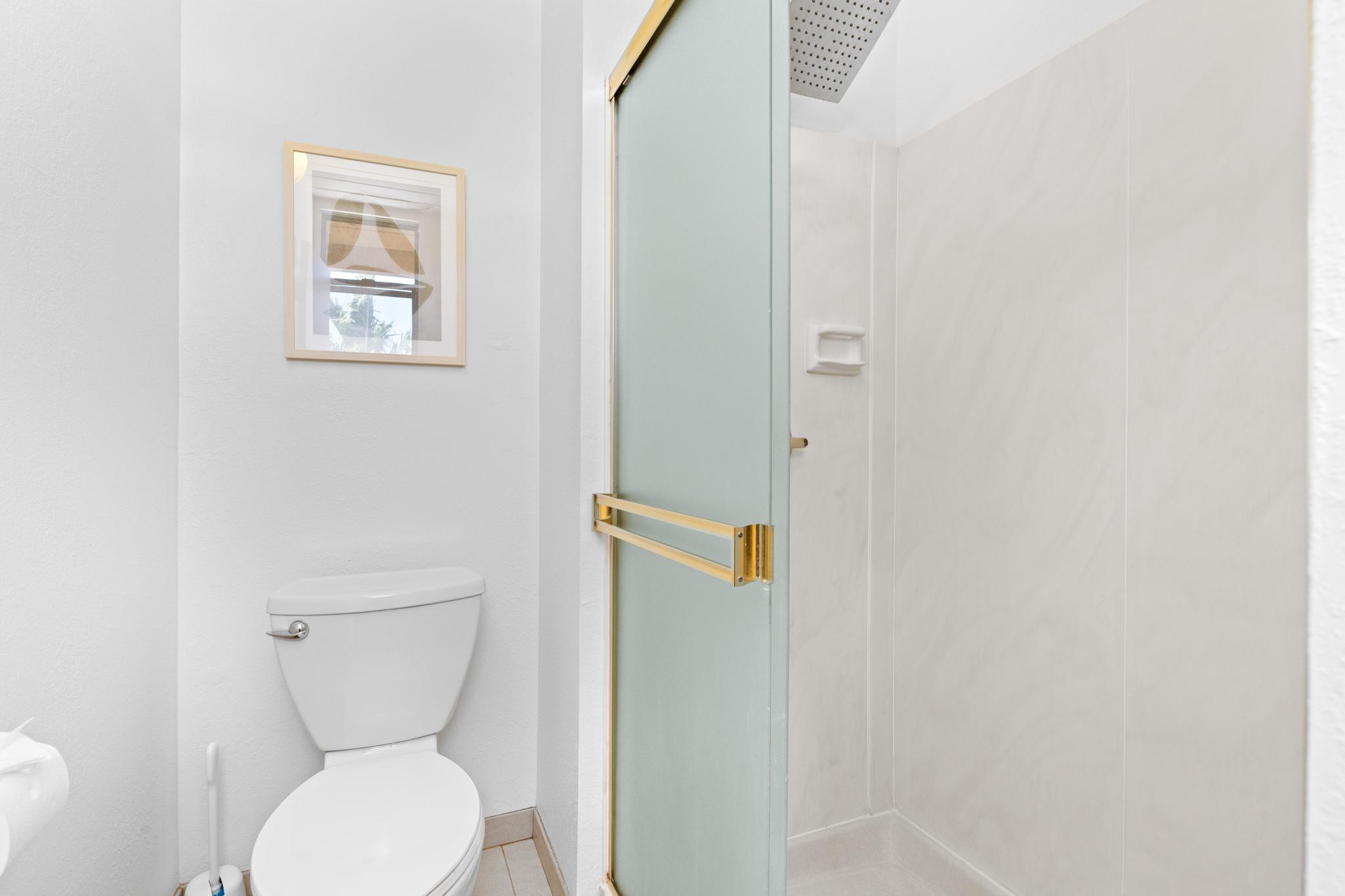 68-3840 Lua Kula Street, Unit F203 Waikoloa, HI 96738 - Photo 19 of 29 a bathroom with a toilet and a shower