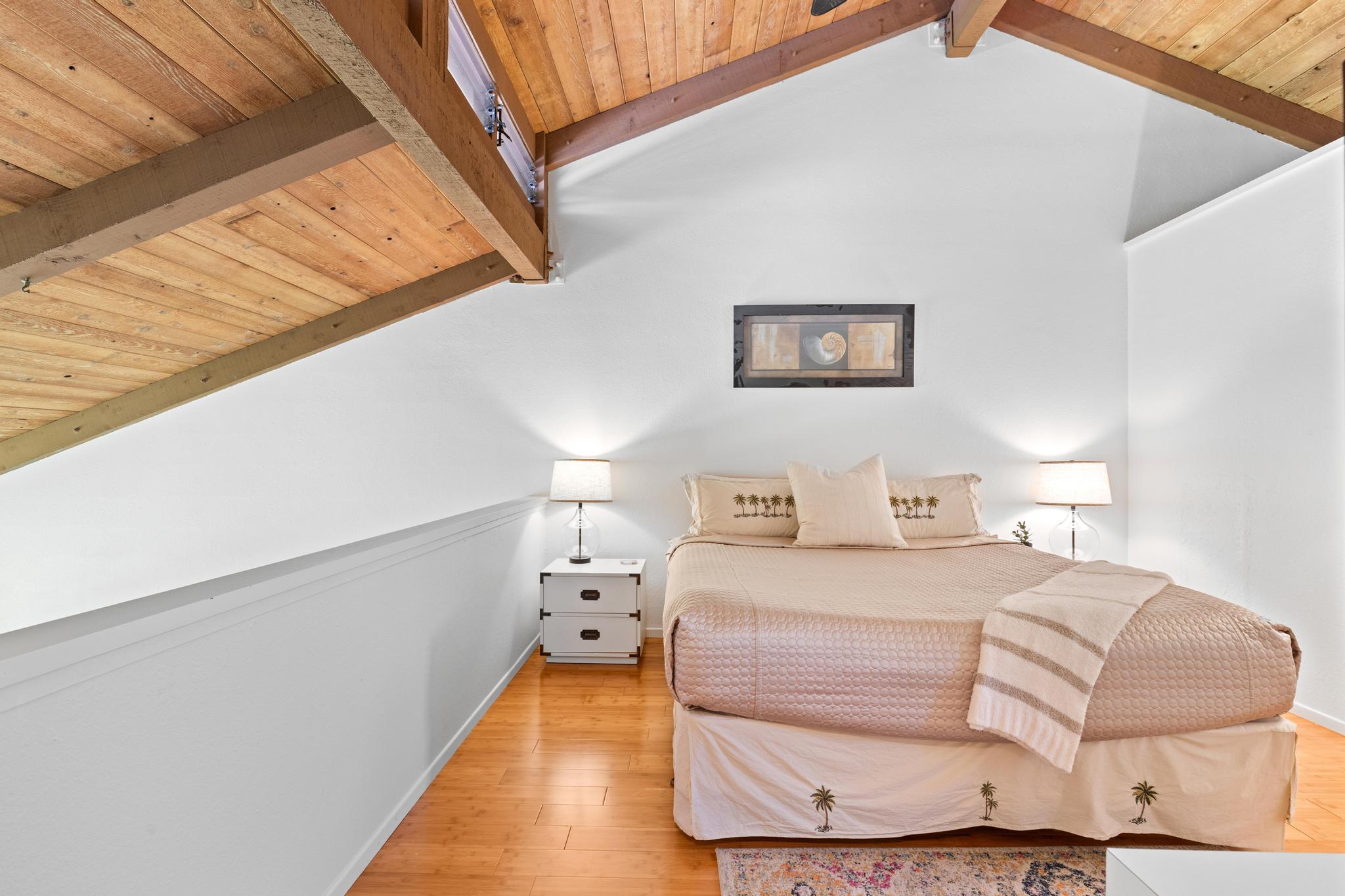 68-3840 Lua Kula Street, Unit F203 Waikoloa, HI 96738 - Photo 22 of 29 a bedroom with a bed and a night stand