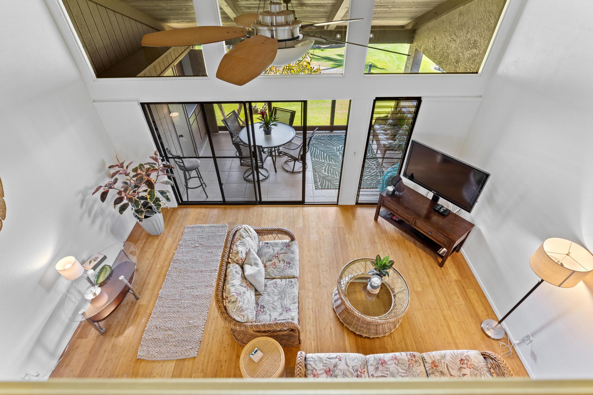 68-3840 Lua Kula Street, Unit F203 Waikoloa, HI 96738 - Photo 24 of 29 view of a dining room with furniture and wooden floor