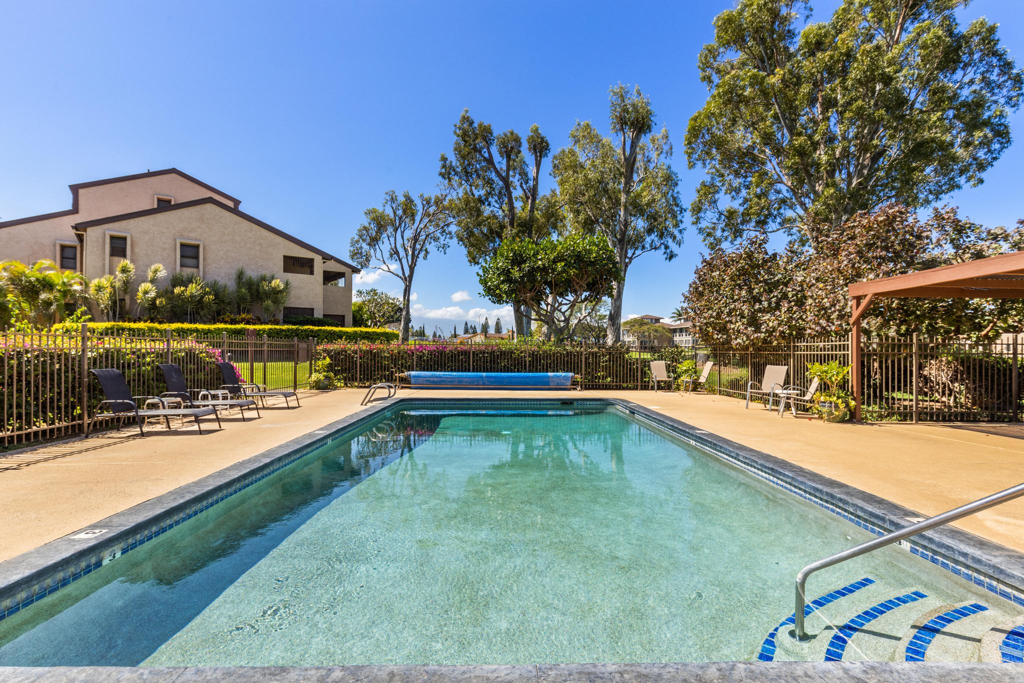 68-3840 Lua Kula Street, Unit F203 Waikoloa, HI 96738 - Photo 25 of 29 a view of swimming pool with a yard