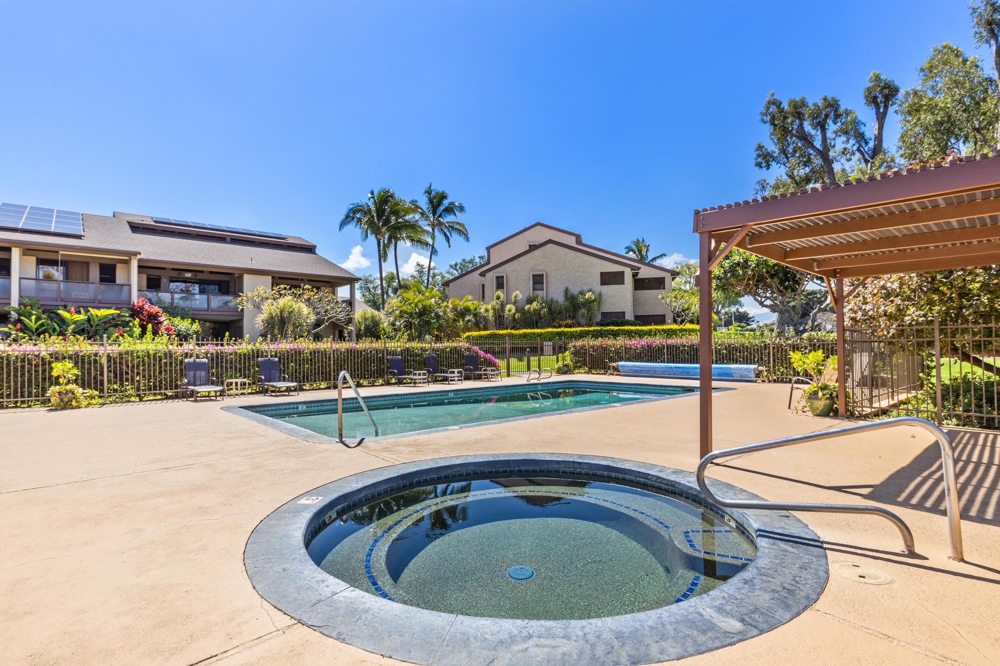 68-3840 Lua Kula Street, Unit F203 Waikoloa, HI 96738 - Photo 26 of 29 a view of a swimming pool with a lounge chairs