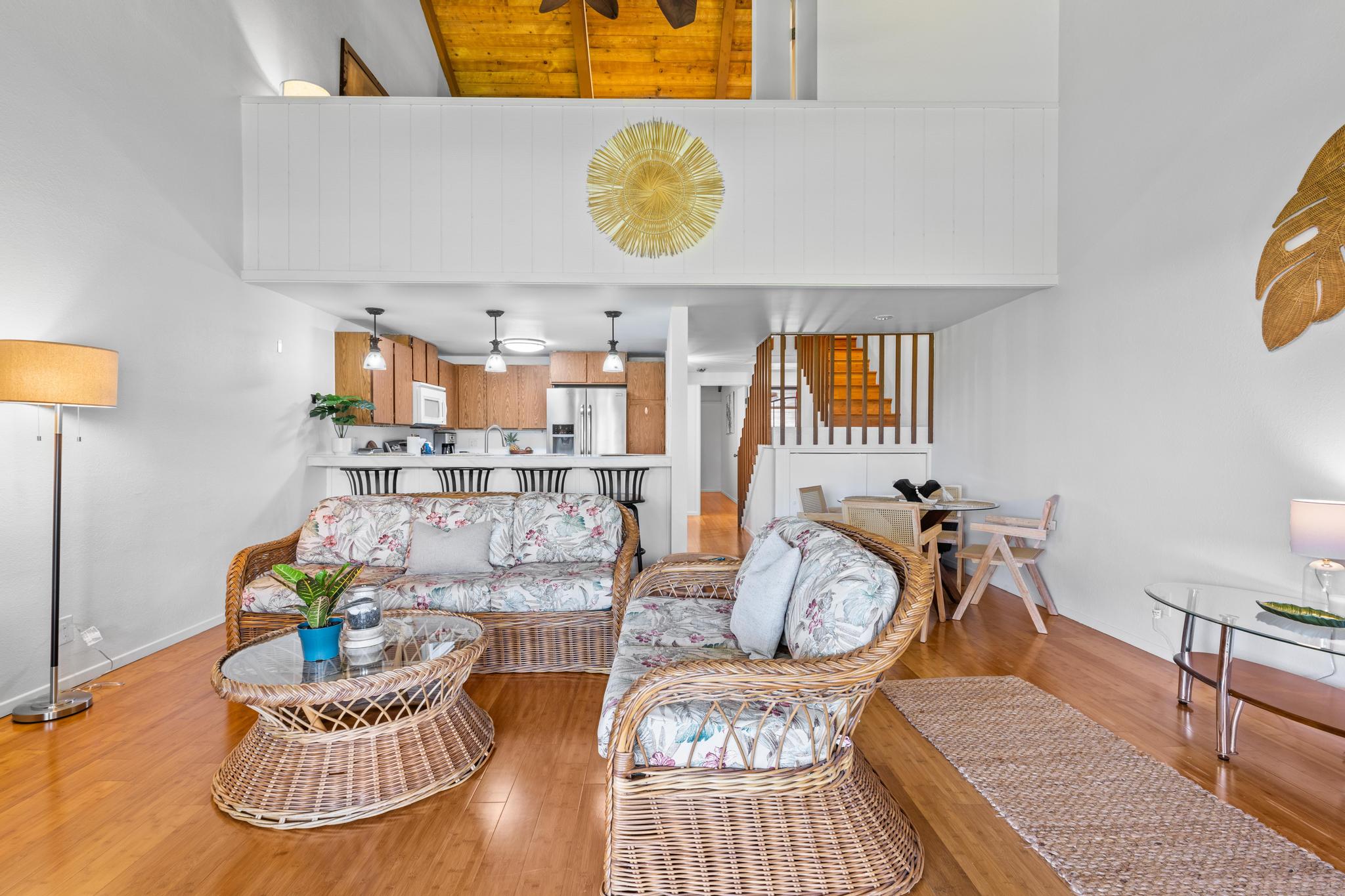 68-3840 Lua Kula Street, Unit F203 Waikoloa, HI 96738 - Photo 4 of 29 a living room with a couch and a chandelier