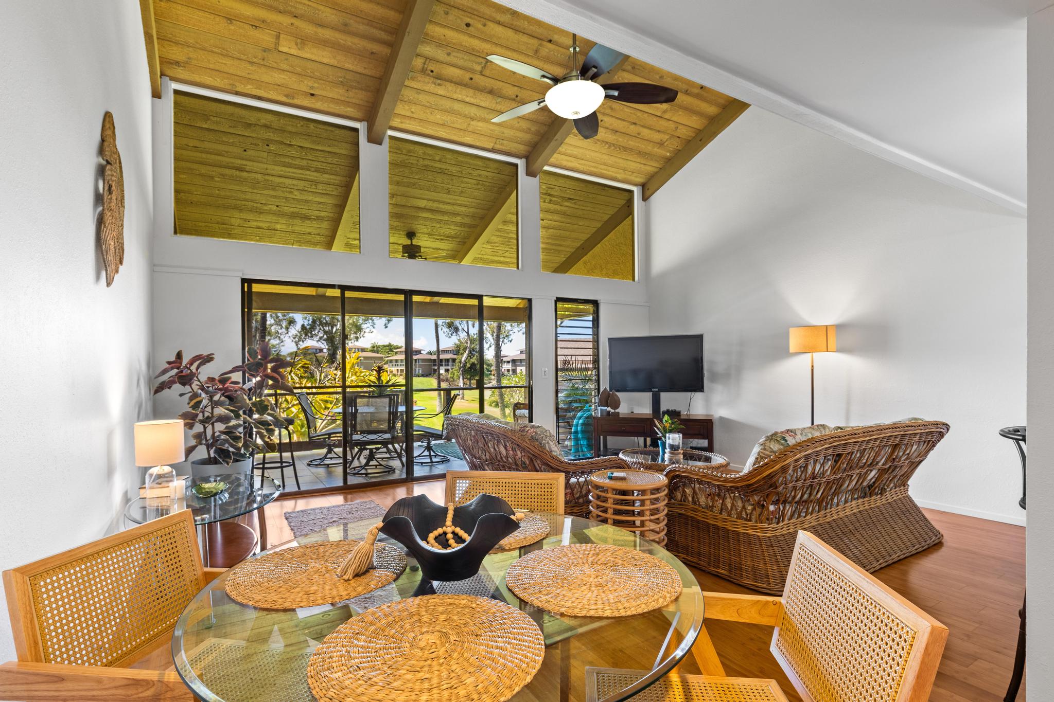 68-3840 Lua Kula Street, Unit F203 Waikoloa, HI 96738 - Photo 5 of 29 a living room with furniture and floor to ceiling windows
