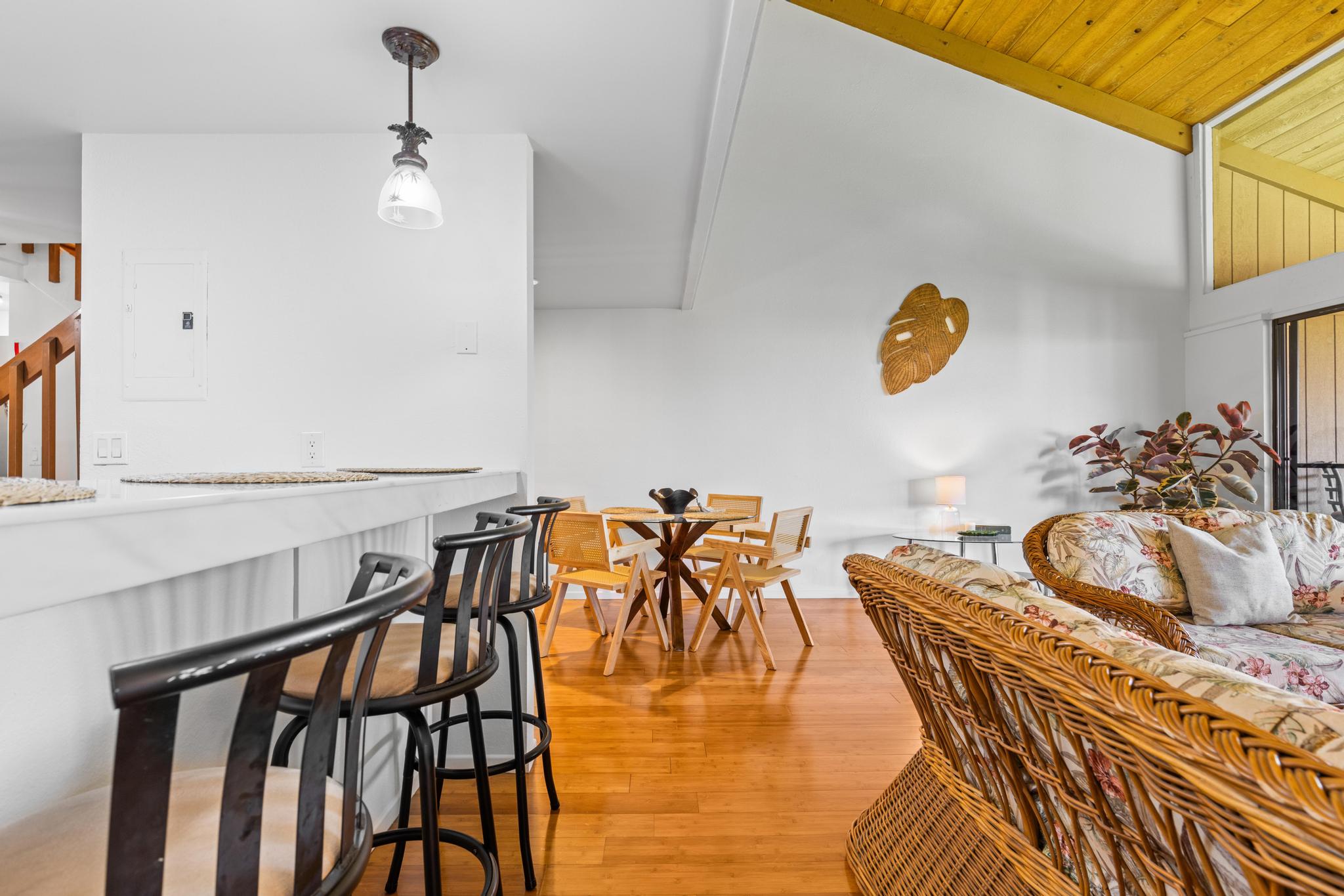 68-3840 Lua Kula Street, Unit F203 Waikoloa, HI 96738 - Photo 6 of 29 a view of a dining room with furniture and wooden floor
