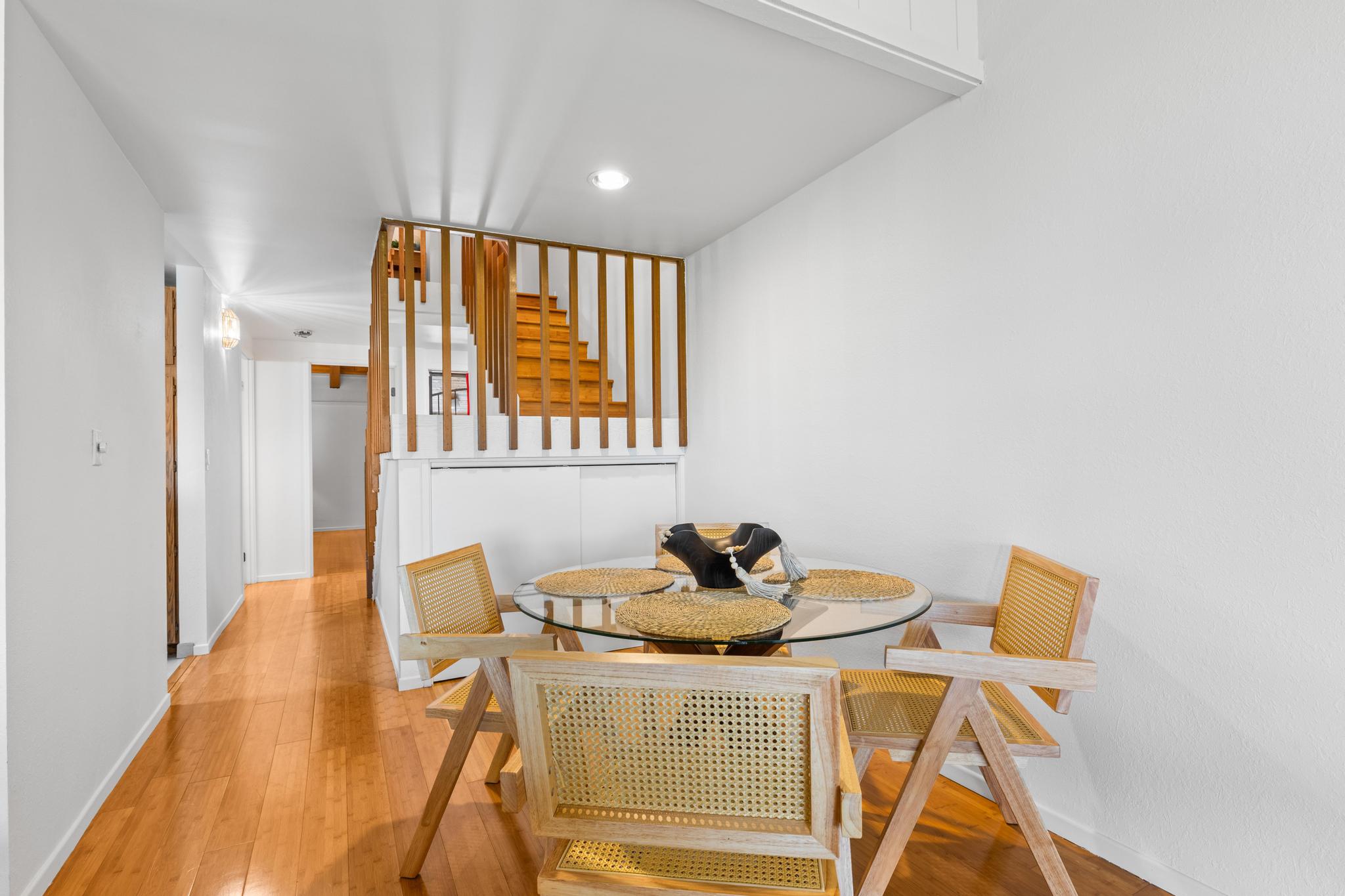 68-3840 Lua Kula Street, Unit F203 Waikoloa, HI 96738 - Photo 10 of 29 a bedroom with a bed and wooden floor