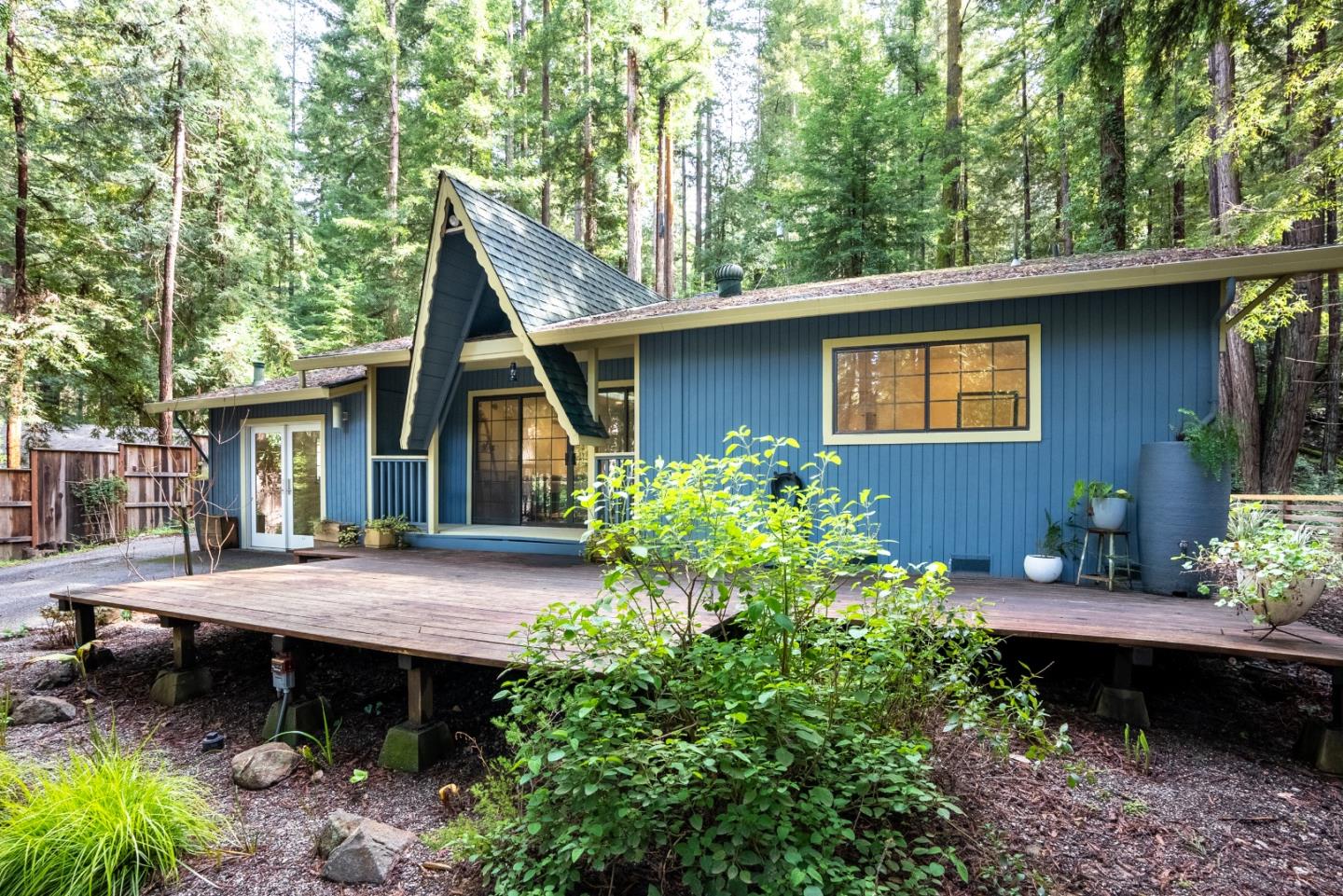 845 Redwood Road Felton, CA 95018 - Photo 1 of 28 a view of a house with a chairs and table in a patio