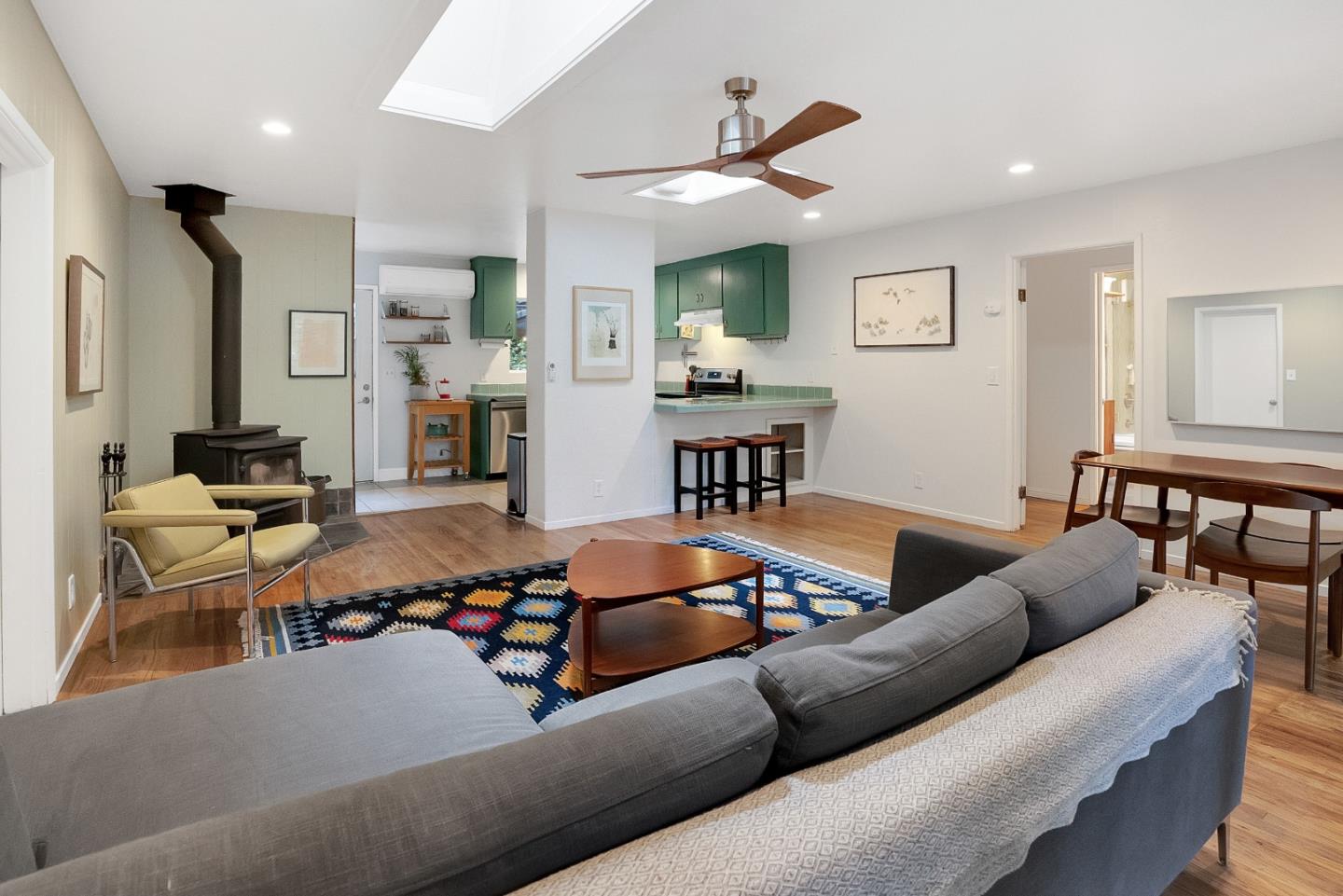 845 Redwood Road Felton, CA 95018 - Photo 12 of 28 a living room with furniture kitchen view and a wooden floor