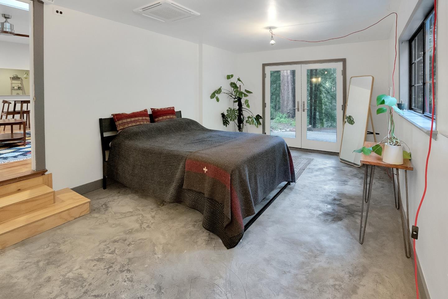 845 Redwood Road Felton, CA 95018 - Photo 15 of 28 a spacious bedroom with a bed and large windows