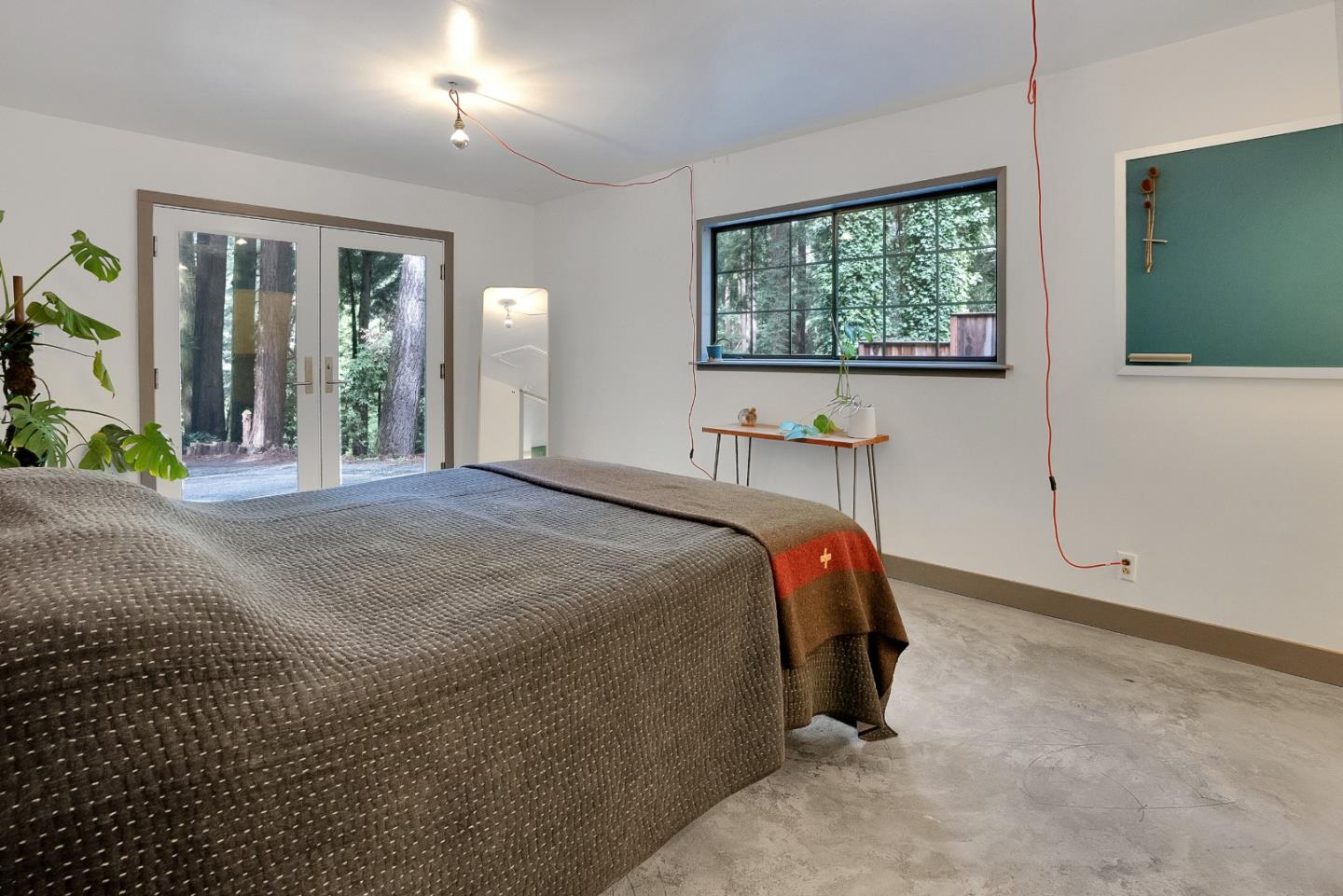 845 Redwood Road Felton, CA 95018 - Photo 17 of 28 a bed sitting in a bedroom next to a window