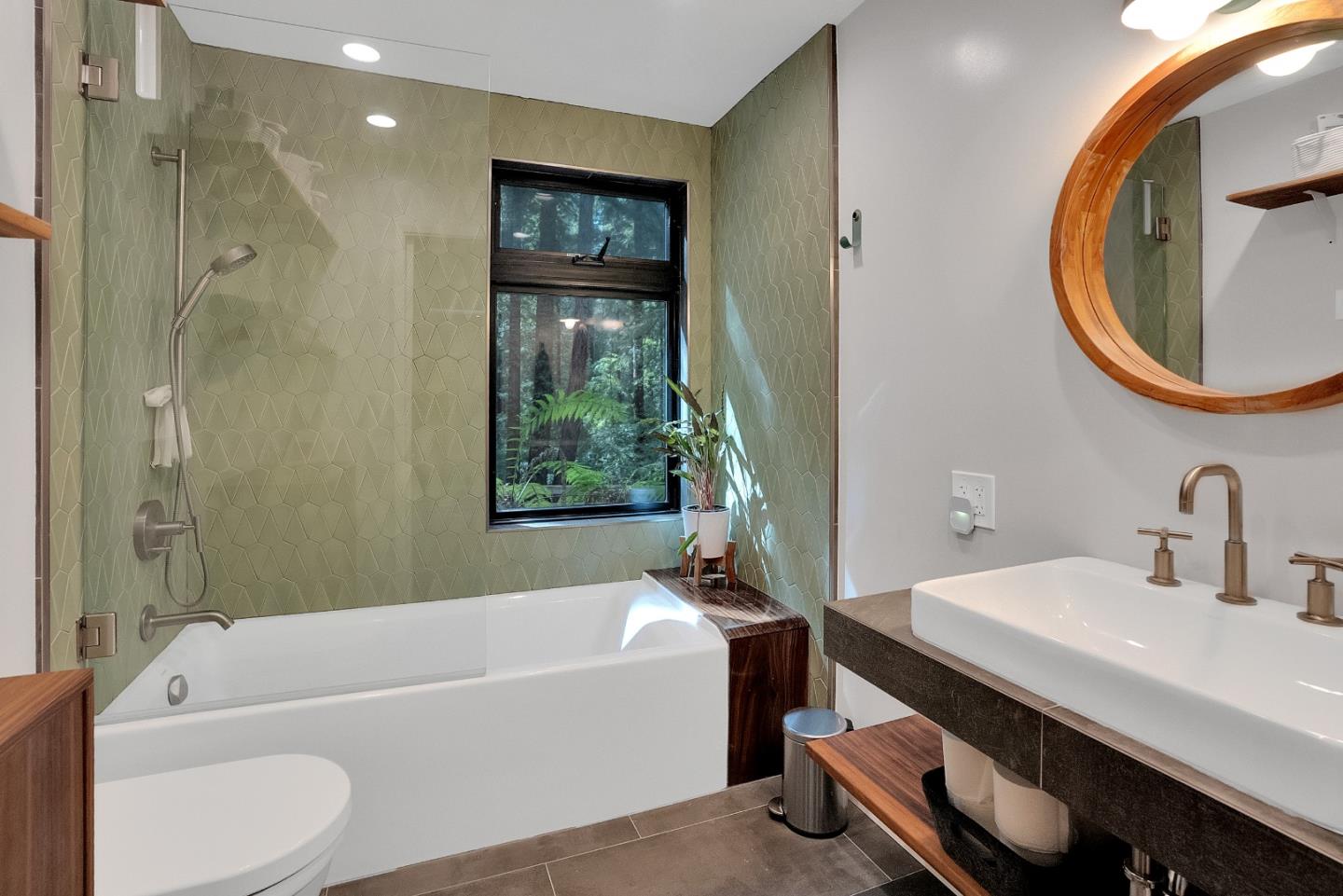 845 Redwood Road Felton, CA 95018 - Photo 21 of 28 a bathroom with a sink a bathtub and a mirror