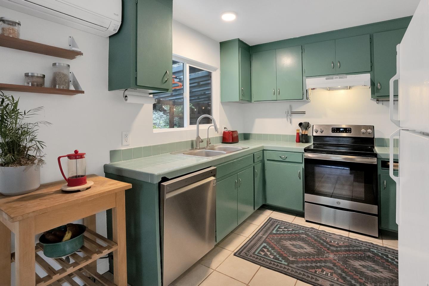 845 Redwood Road Felton, CA 95018 - Photo 5 of 28 a kitchen with a stove and a sink