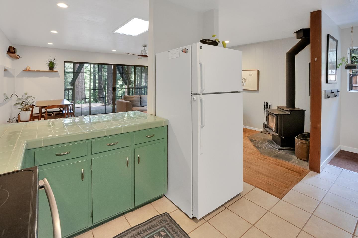 845 Redwood Road Felton, CA 95018 - Photo 6 of 28 a kitchen with a refrigerator and a sink
