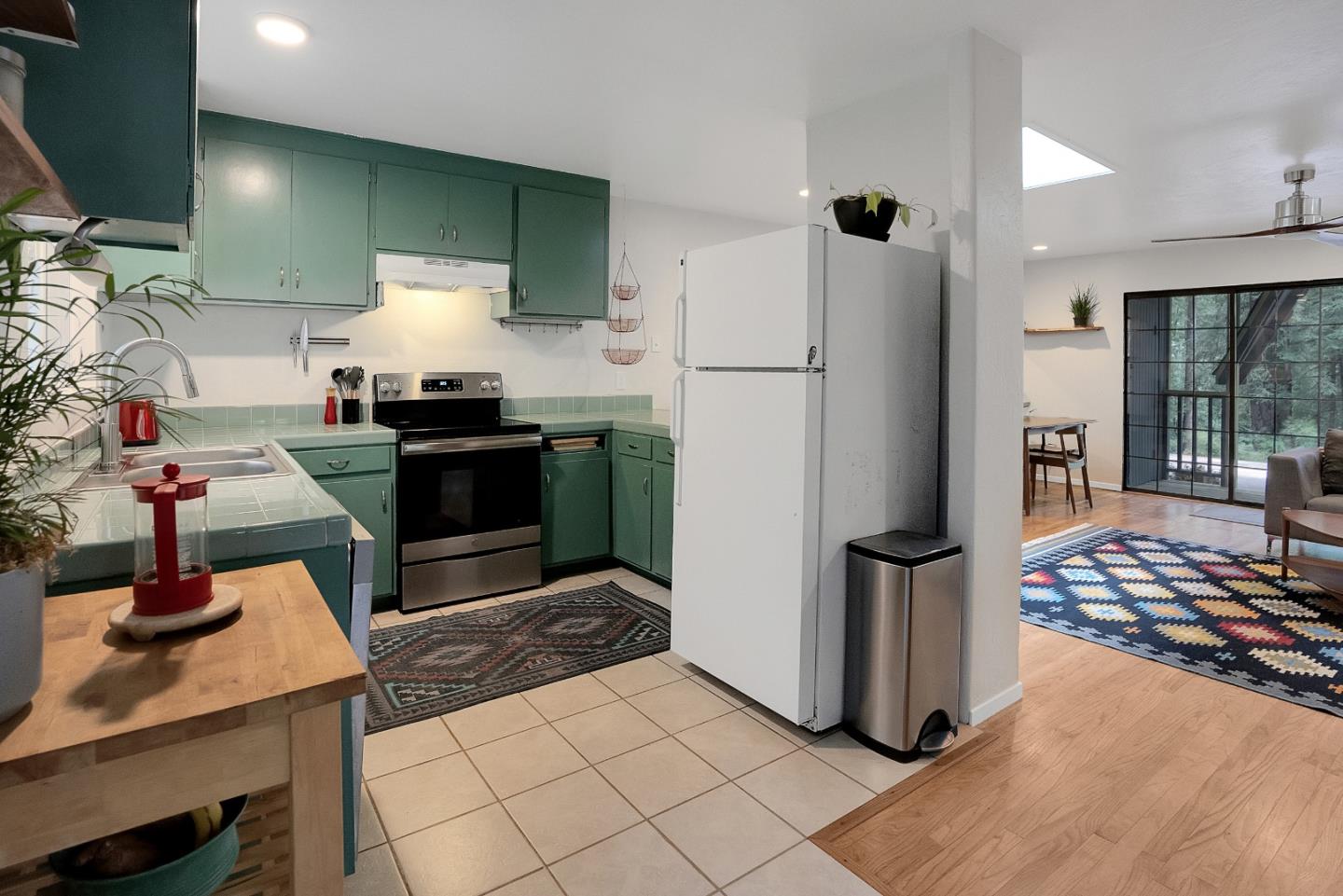 845 Redwood Road Felton, CA 95018 - Photo 7 of 28 a kitchen with refrigerator and stove